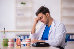 stressed dentist at a desk