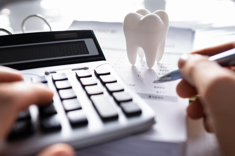 dentist calculating at their desk